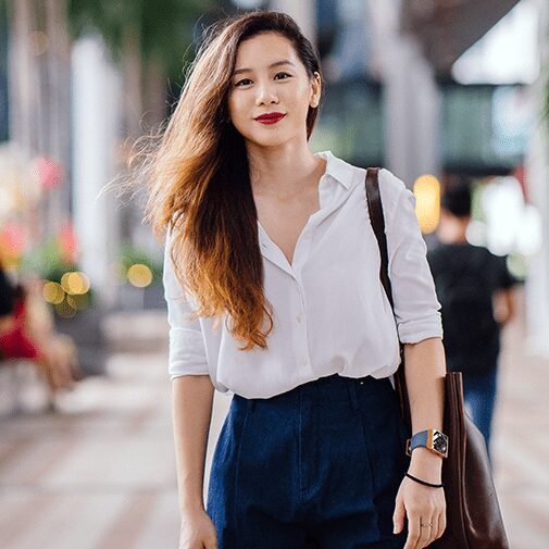 A woman with long hair and wearing white shirt