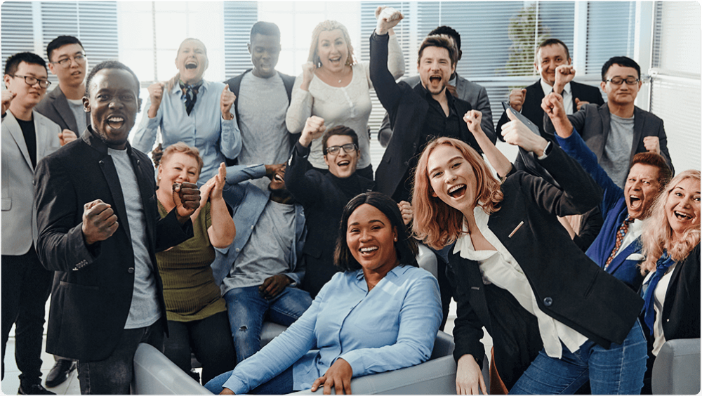 A group of people that are sitting in front of a computer.